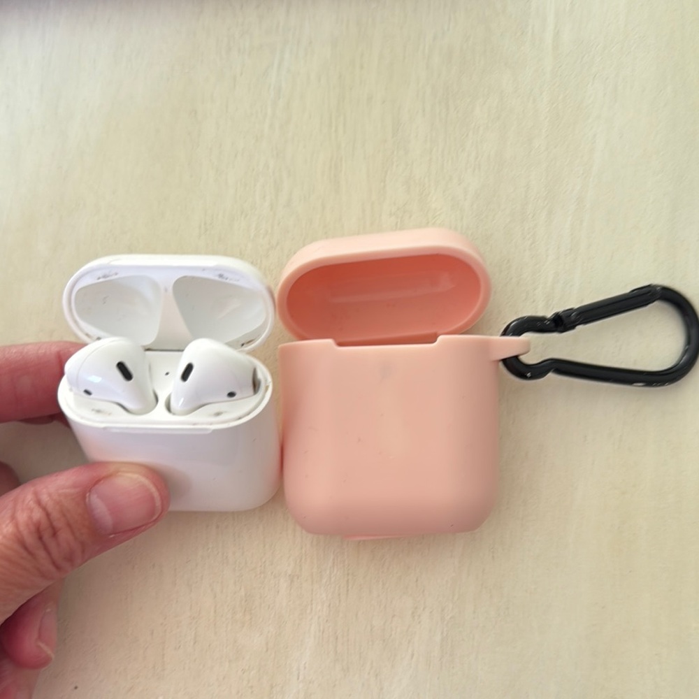 Apple White Earbuds with Pink Case and Black Carabiner